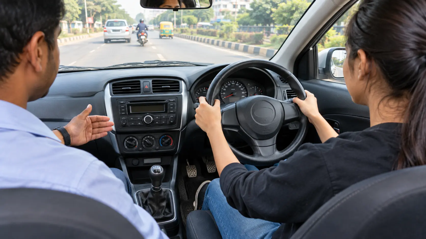 Beginner driver learning manual car controls with instructor inside